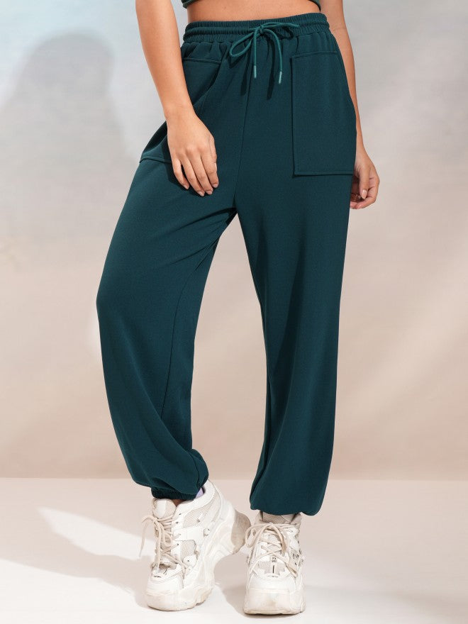 Tokyo Talkies Women Teal Regular Solid Joggers - Teal - Image 1