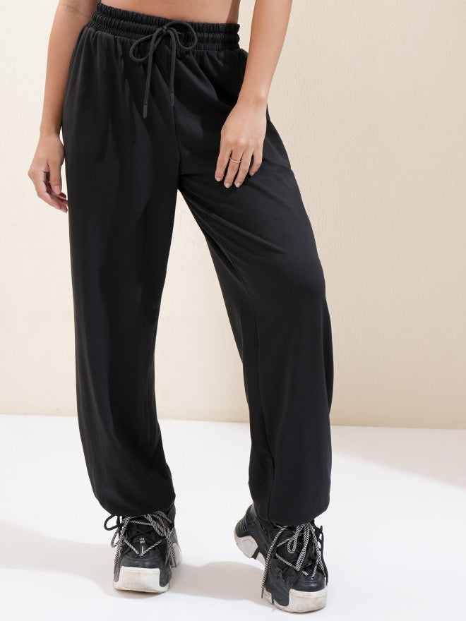 Tokyo Talkies Women Black Solid Regular Fit Joggers - Black - Image 1