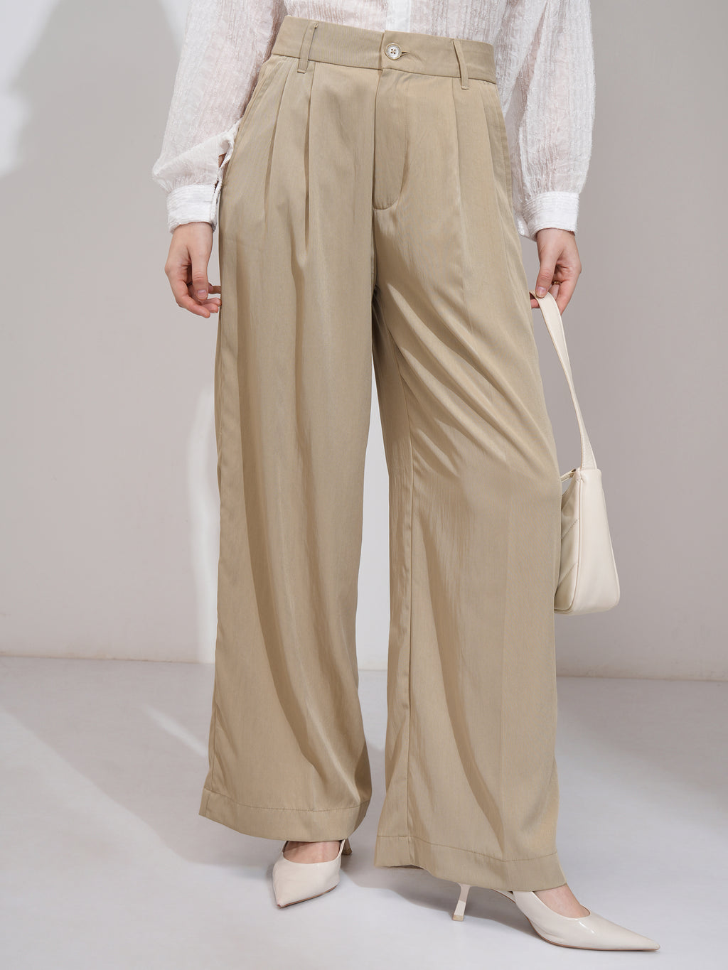Tokyo Talkies Women Beige Solid Flared Casual Trouser - Beige - Image 1