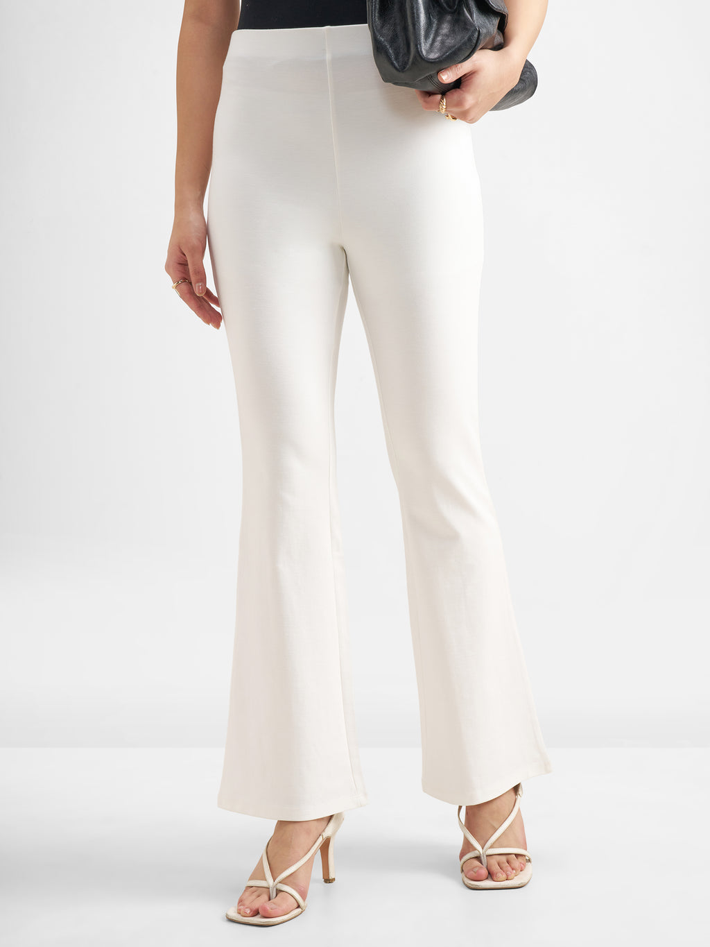 Tokyo Talkies Women White Solid Bootcut Regular Trouser - White - Image 1