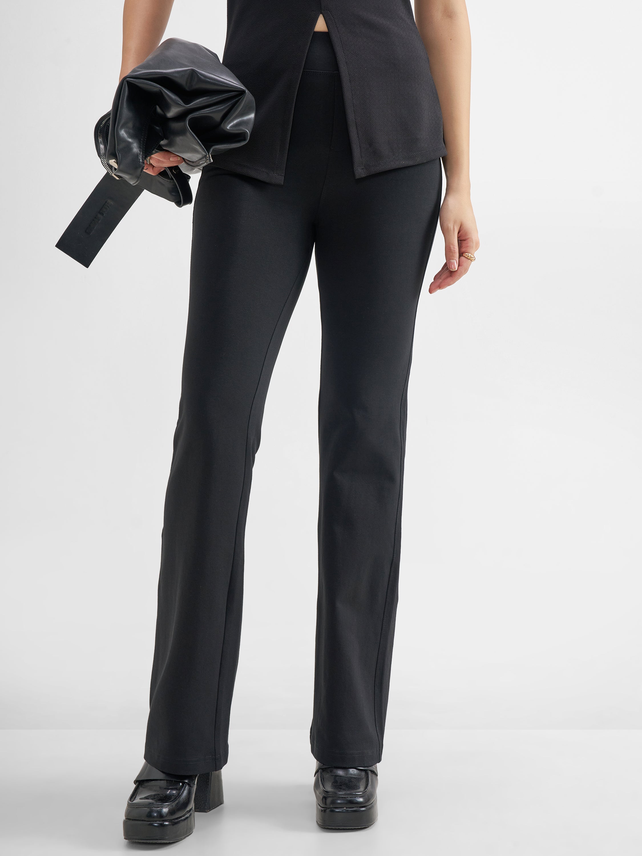 Tokyo Talkies Women Black Solid Bootcut Regular Trouser - Black - Image 1